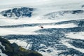 Helicopter tour flying through glacier mountain with snow covered in Icelandic highlands