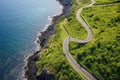 helicopter view of winding coastal cycling path