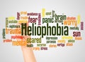 Heliophobia fear of the sun word cloud and hand with marker concept