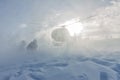 Heliski helicopter takes off in snow powder freeride landed on mountain Royalty Free Stock Photo