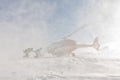 Heliski helicopter takes off in snow powder freeride landed on mountain Royalty Free Stock Photo