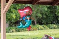 Helium filled birthday party balloon in a shape of a mermaid.