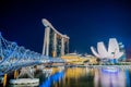 Helix bridge, Marina Bay Sands hotel and the ArtScience Museum by night, in Singapore Royalty Free Stock Photo