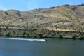 Hell`s Canyon Snake River Idaho speed boat and water skier in the river horizontal Royalty Free Stock Photo