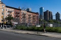 Hell\'s Kitchen Neighborhood Scene with a Vacant Lot and Old Brick Apartment Buildings
