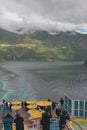 Hellesylt, Geiranger, Stranda, Norway - Jul 09, 2018: Decks of cruise liner, ships wake, fjord Royalty Free Stock Photo