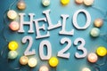 Hello 2023 alphabet letter with cotton ball LED decoration on blue background