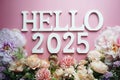 Hello 2025 alphabet letter with flower decoration on pink background Royalty Free Stock Photo