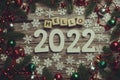 Hello 2022 alphabet letters with Christmas decoration on wooden background Royalty Free Stock Photo