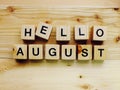 Hello august wooden block alphabet letters on wooden background