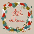 Hello autumn. Autumn wreath with colored leaves. Background with polka dots.