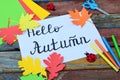 Hello Autumn concept. Making maple leaf from colored paper with your own hands for decoration of greeting card. Handmade crafts. C