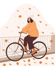 Hello Autumn. Girl rides a bicycle in an autumn park. Park and yellow leaves.Active person traveling on bike, eco city Royalty Free Stock Photo