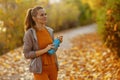 pensive fit 40 years old woman in fitness clothes in park Royalty Free Stock Photo