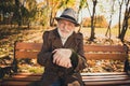 Hello autumn. Photo of positive old man rest relax in fall nature town forest colorful sunset park sit bench walking