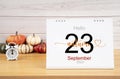 The Hello autumn on 23rd September 2023 desk calendar with pumpkins Royalty Free Stock Photo