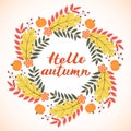 Hello Autumn written with brush. Calligraphy handwritten lettering. Wreath with colorful leaves, flowers and pumpkin Royalty Free Stock Photo