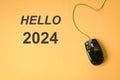 Hello 2024 with computer mouse. Top view Royalty Free Stock Photo