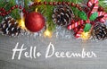 Hello December.Christmas decoration on old wooden background.Winter holidays concept. Royalty Free Stock Photo
