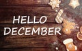 Hello December greeting card. Flat lay composition with tasty Christmas cookies on wooden table Royalty Free Stock Photo