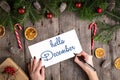 HELLO DECEMBER hand lettering inscription on wooden background Royalty Free Stock Photo