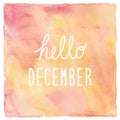 Hello December text on red and yellow watercolor background