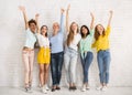 Diverse Women Waving Hands Standing Against White Wall Indoor