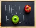 Hello Fall Hand Lettering Typography with Ripe Red Green Apples on Black Chalkboard. Autumn Harvest Thanksgiving.