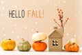 Hello fall message with pumpkins with a house