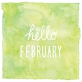 Hello February text on green watercolor background