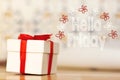Hello friday message with white gift box with red ribbon on wood background Royalty Free Stock Photo