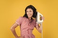 hello. happy and smiling housewife. retro girl with electric iron. vintage woman ironing clothes. housekeeping. pinup Royalty Free Stock Photo