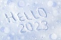 Hello 2023. Inscription on white snow surface. Happy new year concept