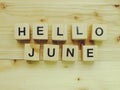 Hello june wooden block alphabet letters on wooden background