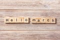 Hello March word written on wood block. Hello March text on table, concept