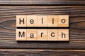 Hello March word written on wood block. Hello March text on table, concept