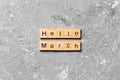 Hello March word written on wood block. hello March text on table, concept