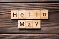 Hello May word written on wood block. Hello May text on table, concept