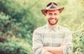 Hello. muscular ranch man in cowboy hat care plants. Eco farm worker. Harvest. happy earth day. Eco living. farming and Royalty Free Stock Photo