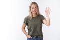 Hello nice to meet you. Portrait of friendly-looking charming outgoing female coworker with blond hair raise palm and