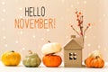 Hello November message with pumpkins with a house Royalty Free Stock Photo
