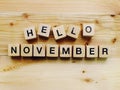 Hello november wooden block alphabet letters on wooden background