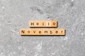 Hello november word written on wood block. hello november text on table, concept Royalty Free Stock Photo