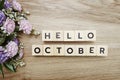 Hello October alphabet letters on wooden background