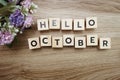 Hello October alphabet letters on wooden background