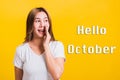 Hello October, Asian Thai happy portrait beautiful young woman standing hold a hand on mouth talking whispering secret