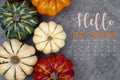 The Hello October 2023 Calendar and pumpkins with autuma leaf on old wood background Royalty Free Stock Photo