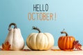 Hello October message with pumpkins