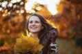 Smiling trendy 40 years old woman in beige coat and orange hat Royalty Free Stock Photo