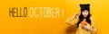 Hello October with woman holding a pumpkin Royalty Free Stock Photo